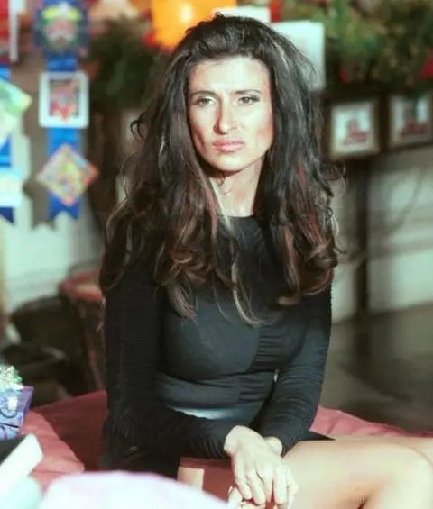 Ronni Ancona is seen as an exaggerated version of Victoria Beckham