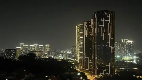 BBC/ Lulu Luo A night shot of Ho Chi Minh City