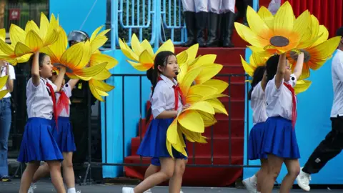 BBC/ Lulu Luo School children rehearsing for the anniversary parade