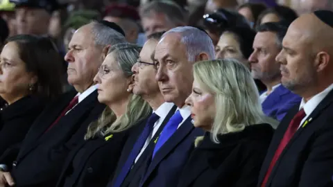 EPA Benjamin Netanyahu (C) attends a ceremony marking Holocaust Remembrance Day, at the Yad Vashem World Holocaust Remembrance Centre, Jerusalem, on 23 April 2024
