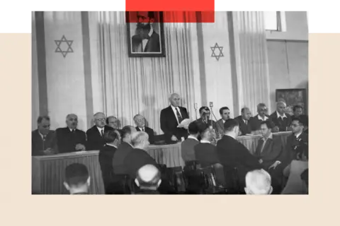 Getty Images Members of the newly created state of Israel gathered to hear Prime Minister David Ben Gurion read the Jewish