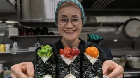 Getty Images Owner of Onigiri Bongo, a shop specialising in rice balls known as
