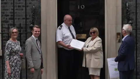 Campaigners hand in a petition to Number 10 Downing Street